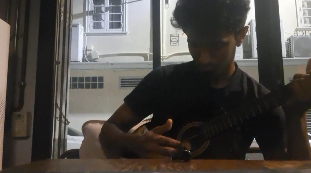 Playing the ukulele